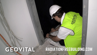Putting grounding tape on shielding paint in new apartment construction