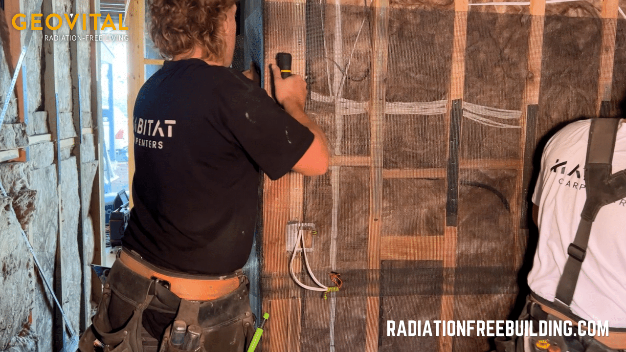 GPA shielding mesh is stapled onto timber framing in EMF radiation-free home construction
